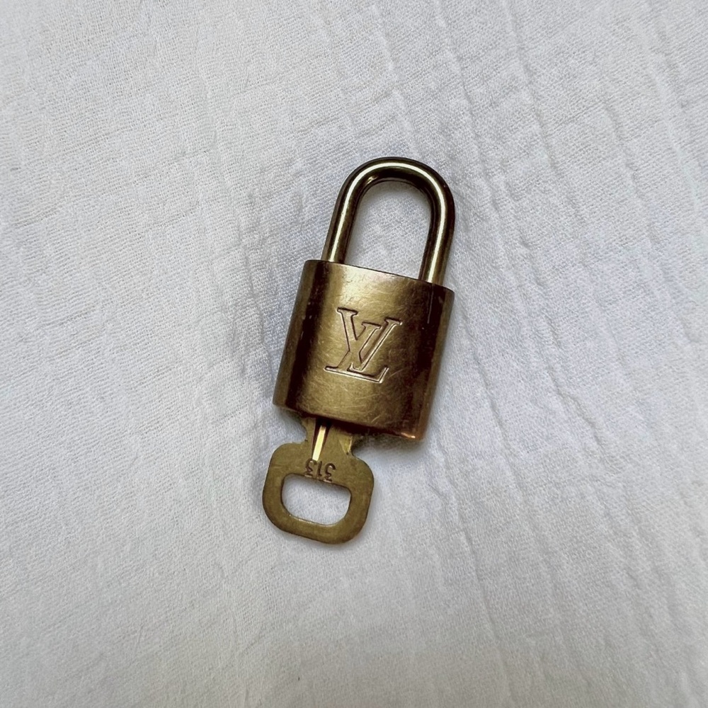Louis Vuitton lock and key Vintage 100% Authentic